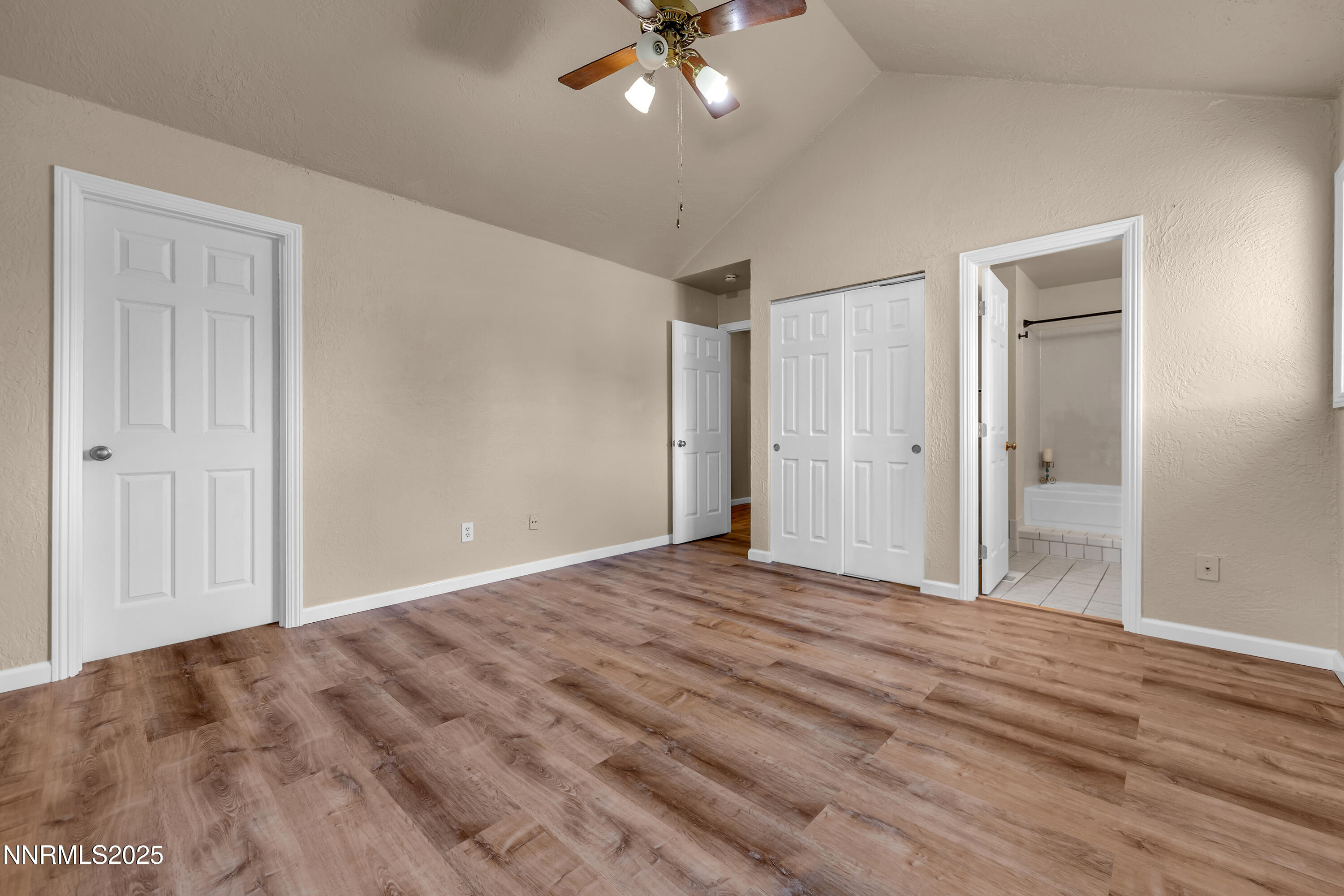 1265 Searchlite Court Reno, NV 89503 - Photo 20 of 43 a view of an empty room with a chandelier fan