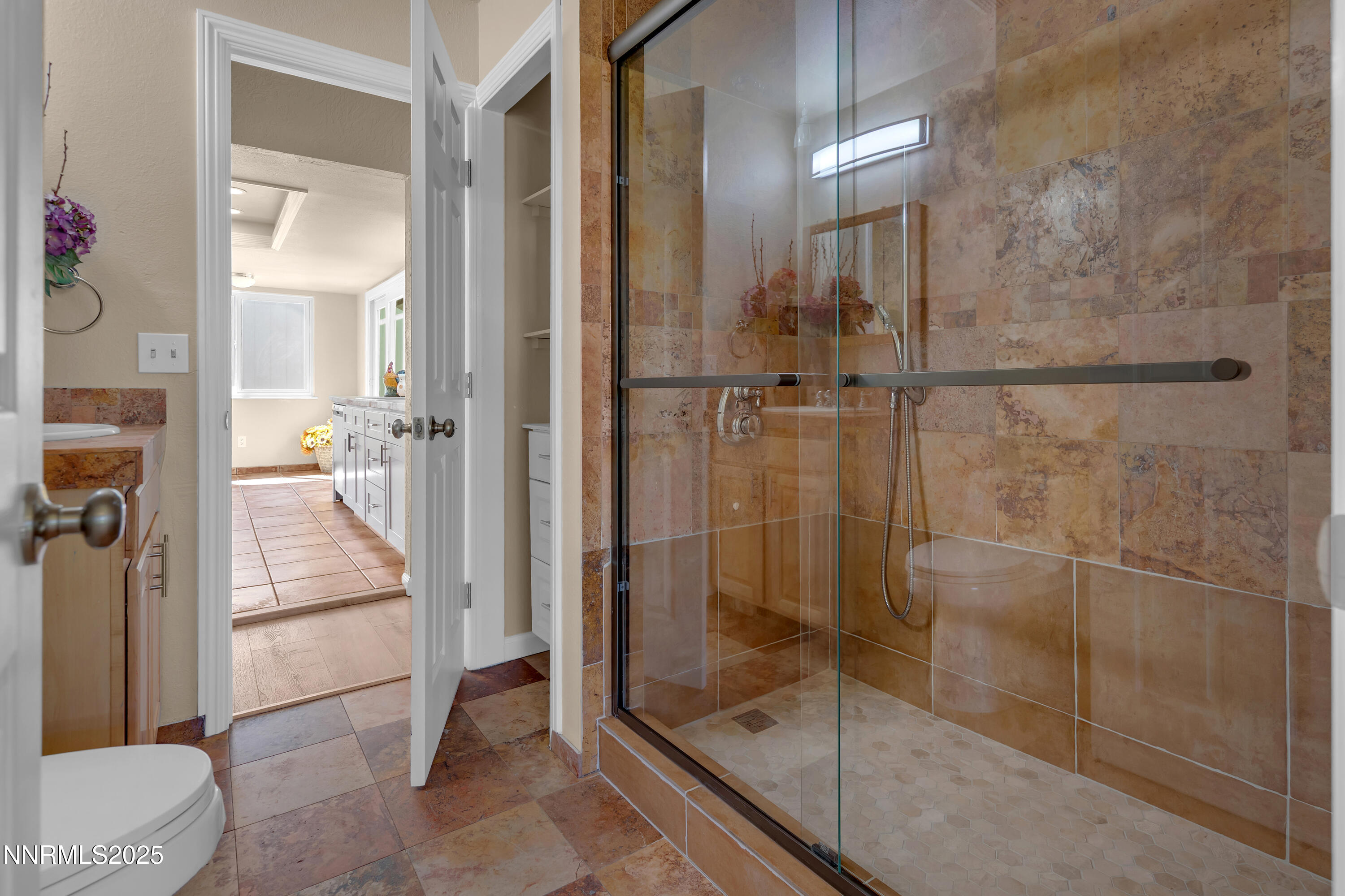 1265 Searchlite Court Reno, NV 89503 - Photo 30 of 43 a bathroom with a glass shower door