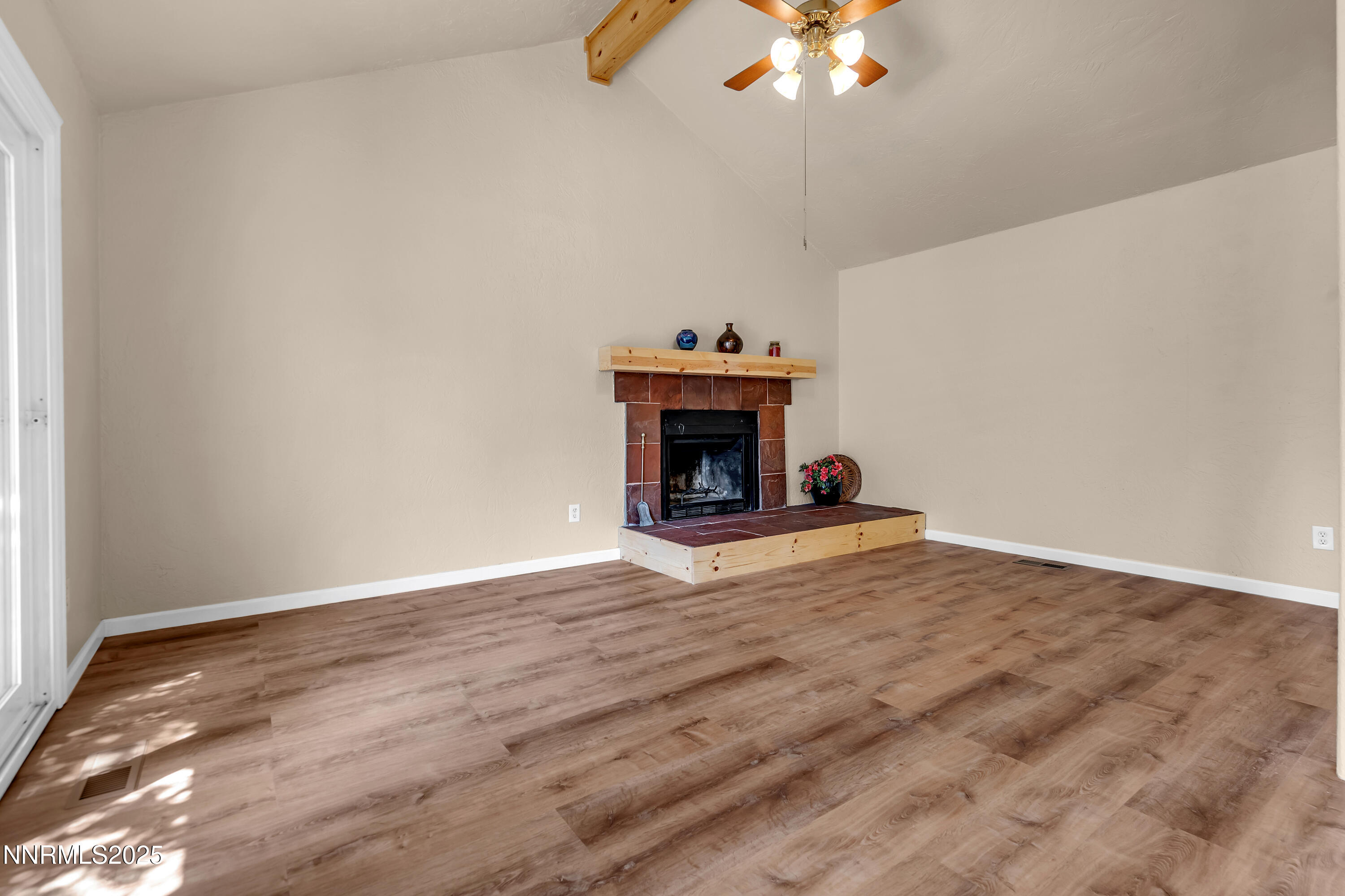 1265 Searchlite Court Reno, NV 89503 - Photo 4 of 43 a view of an empty room with a chandelier fan