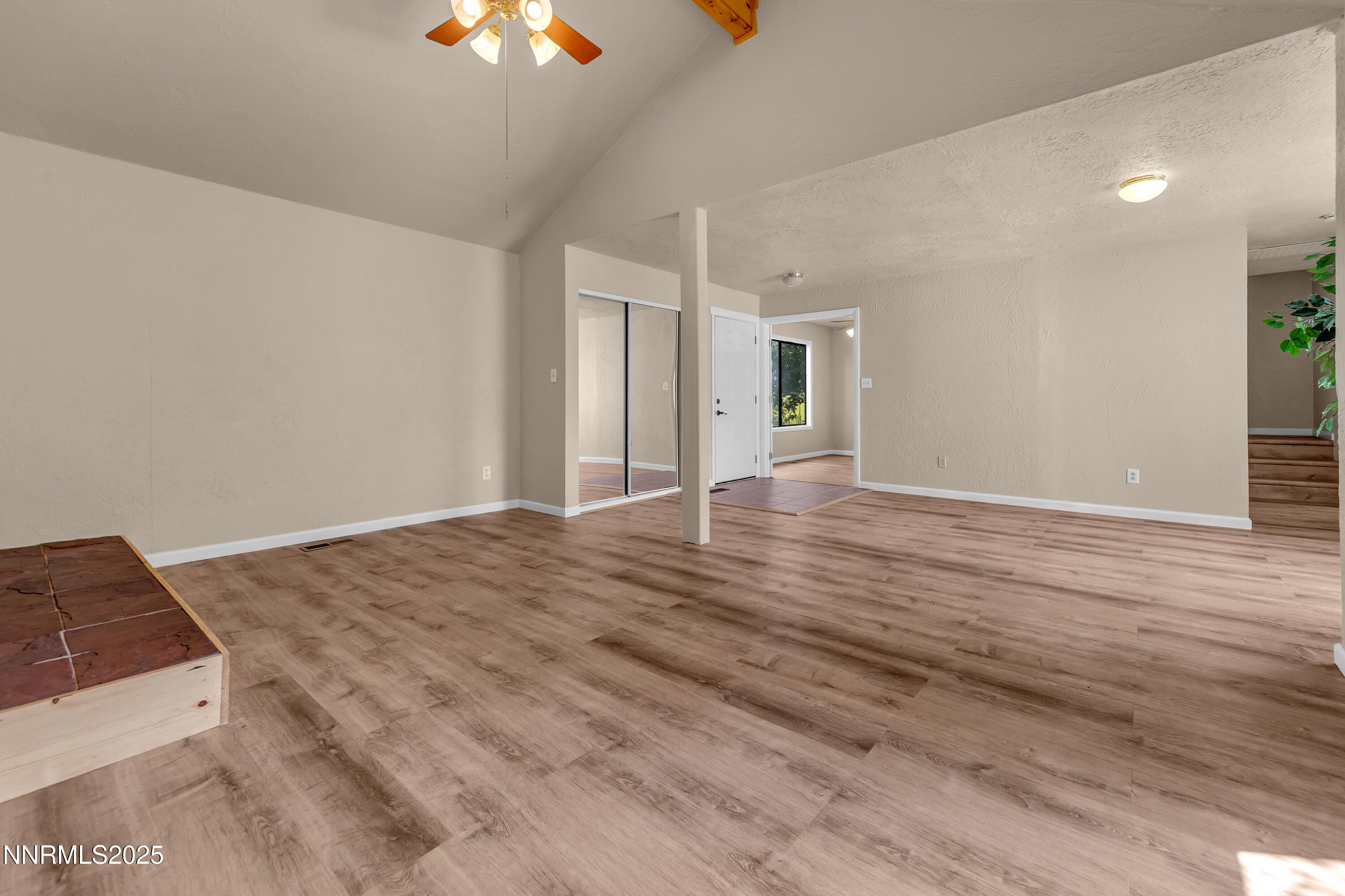 1265 Searchlite Court Reno, NV 89503 - Photo 6 of 43 a view of a livingroom with wooden floor and chandelier