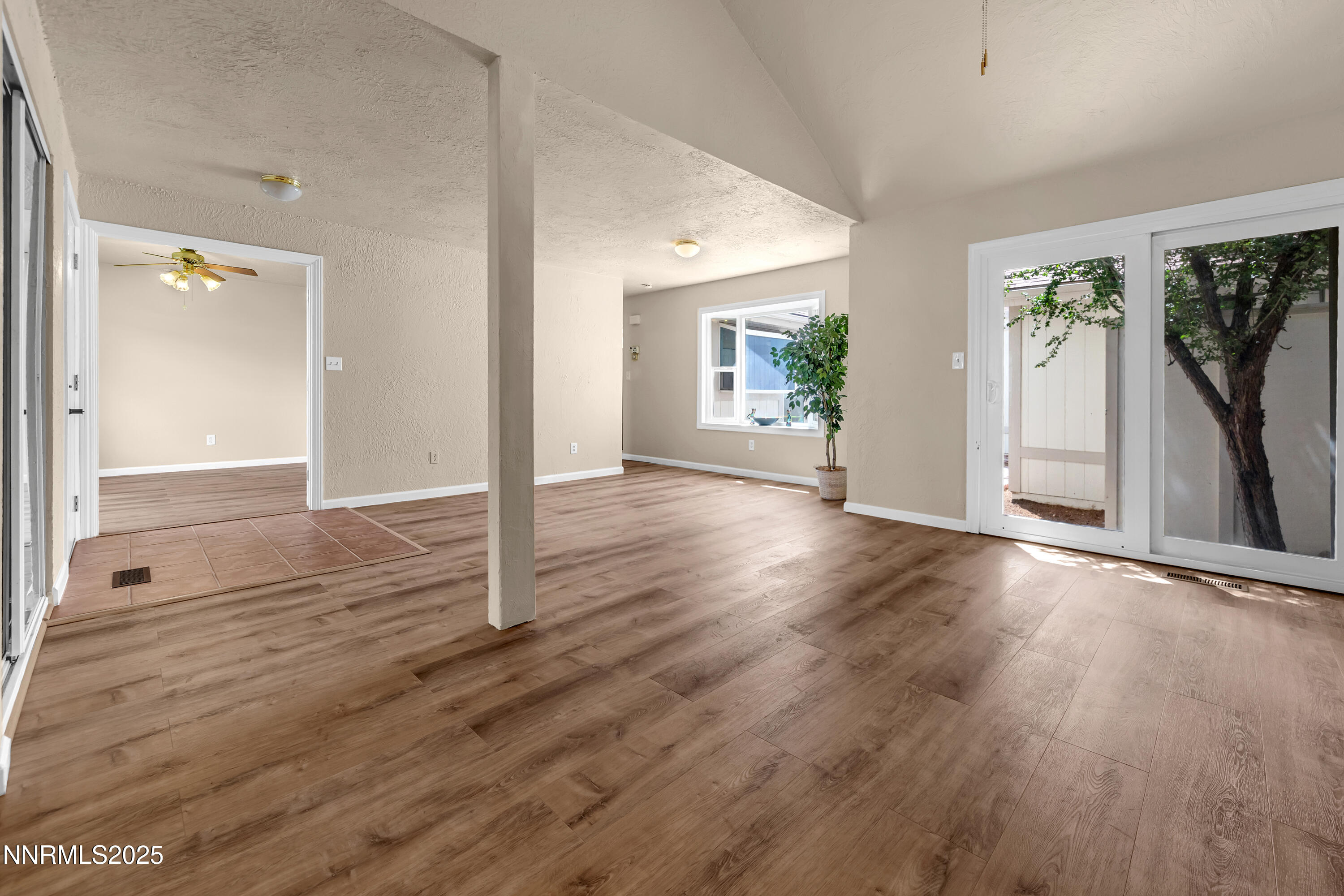 1265 Searchlite Court Reno, NV 89503 - Photo 7 of 43 wooden floor in an empty room with a window