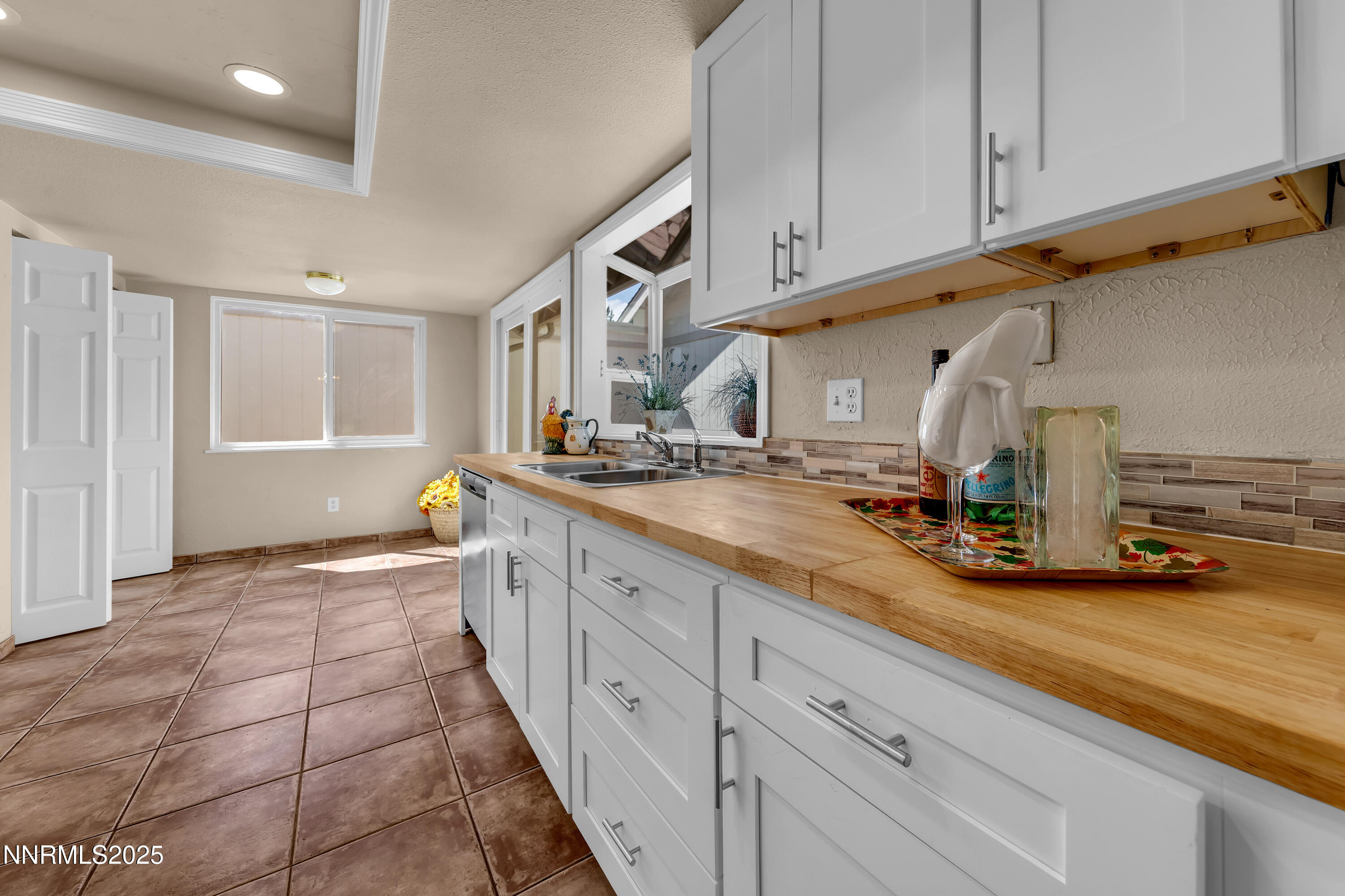1265 Searchlite Court Reno, NV 89503 - Photo 9 of 43 a kitchen with sink and cabinets