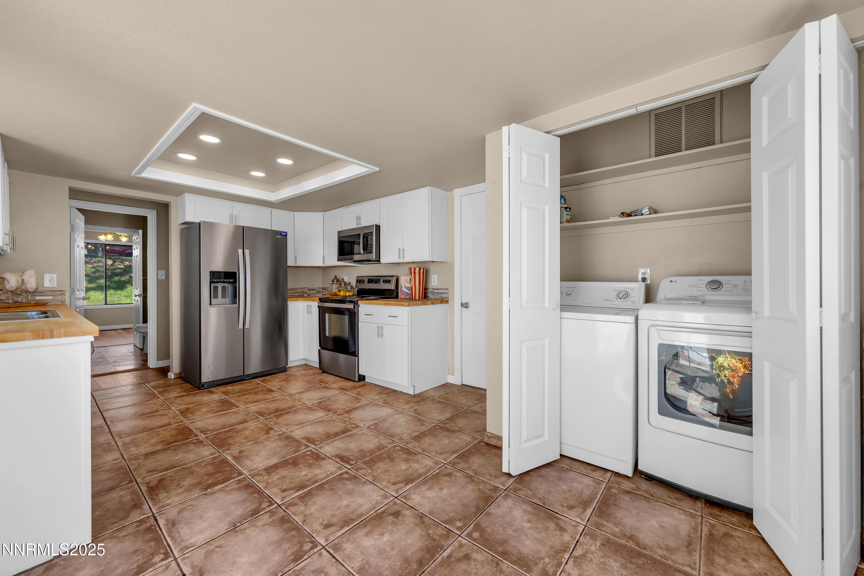 1265 Searchlite Court Reno, NV 89503 - Photo 10 of 43 a view of a kitchen with refrigerator and windows