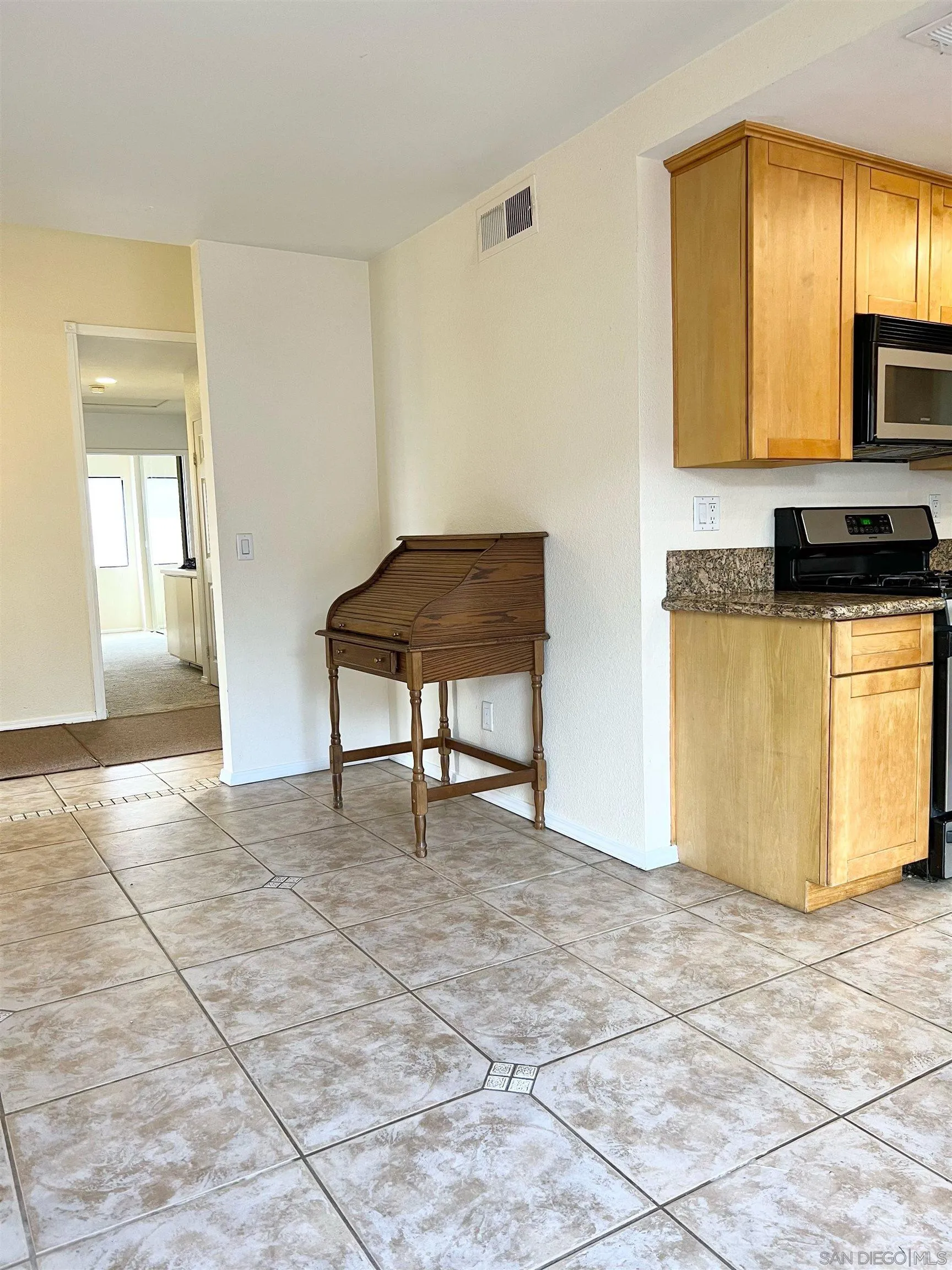 9212 Lake Hill Road Santee, CA 92071 - Photo 13 of 42 a view of an empty room with window and a kitchen