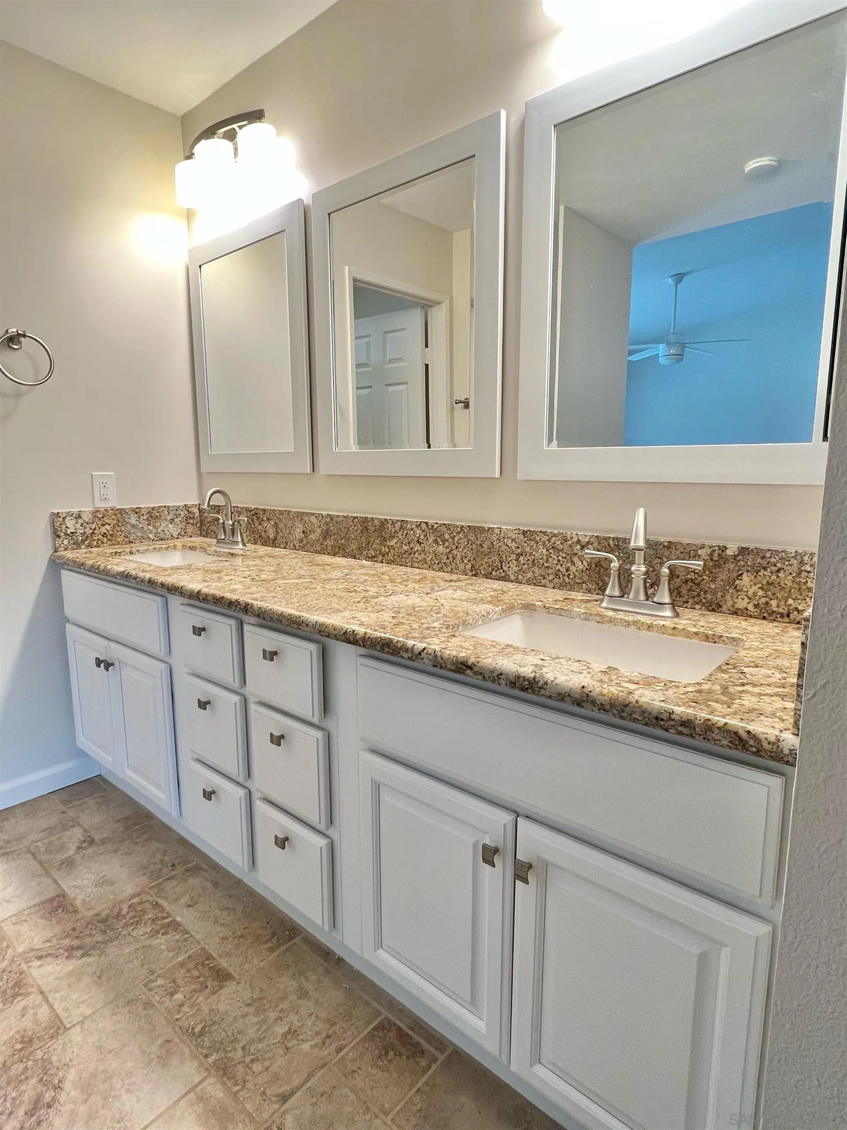 9212 Lake Hill Road Santee, CA 92071 - Photo 20 of 42 a bathroom with a granite countertop sink double and mirror