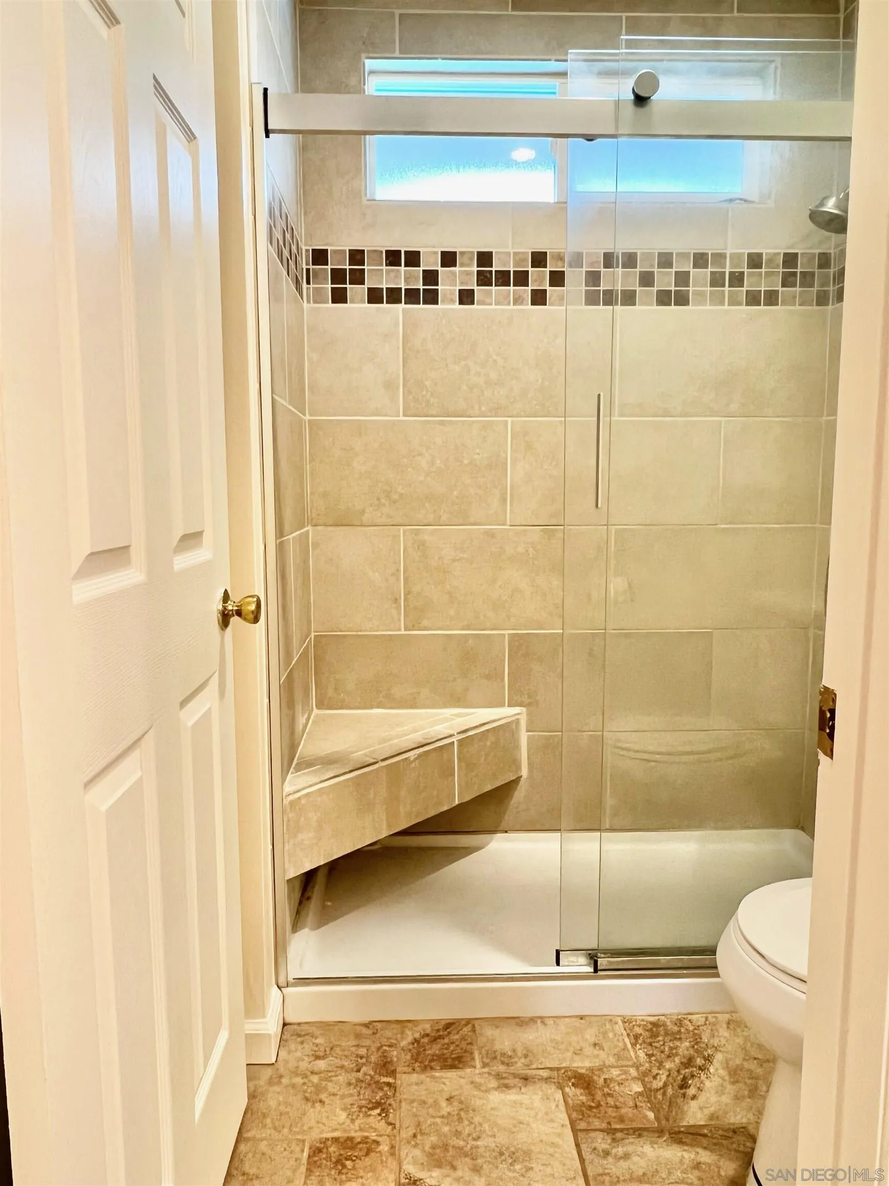 9212 Lake Hill Road Santee, CA 92071 - Photo 21 of 42 a bathroom with a bathtub and a shower