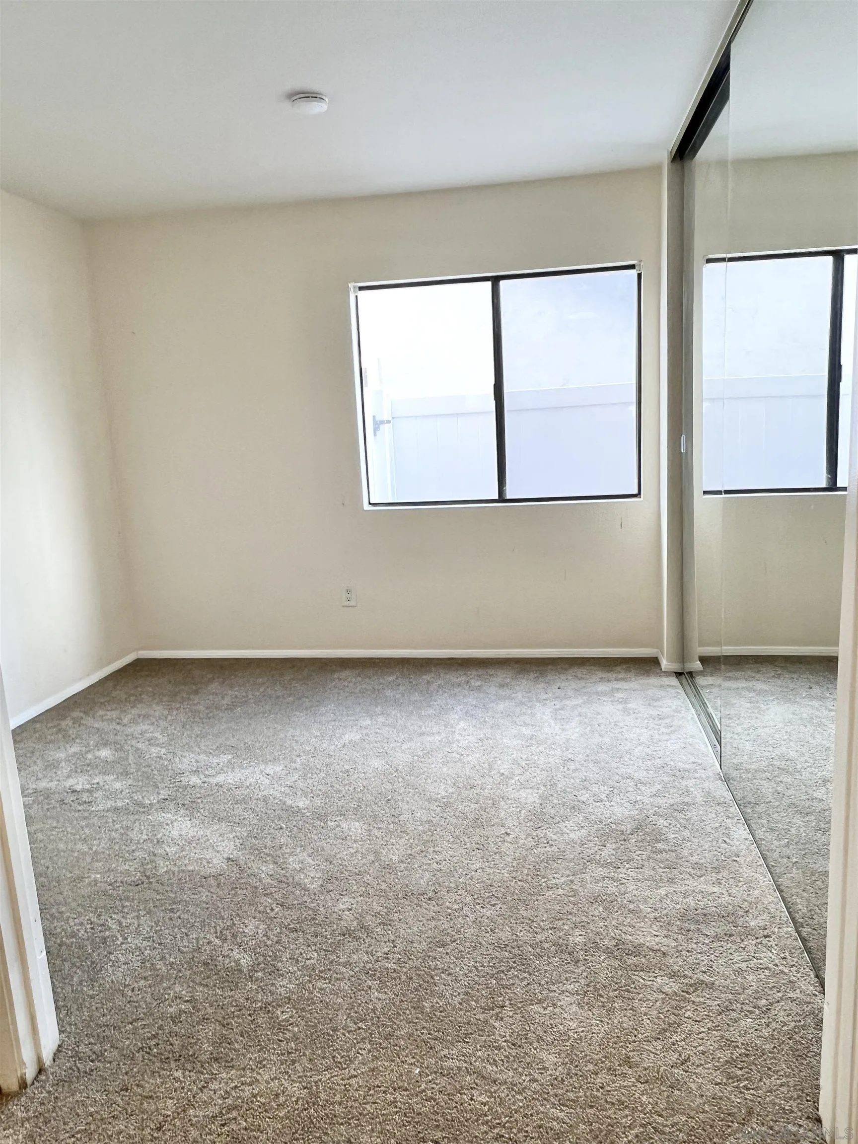 9212 Lake Hill Road Santee, CA 92071 - Photo 24 of 42 an empty room with a window
