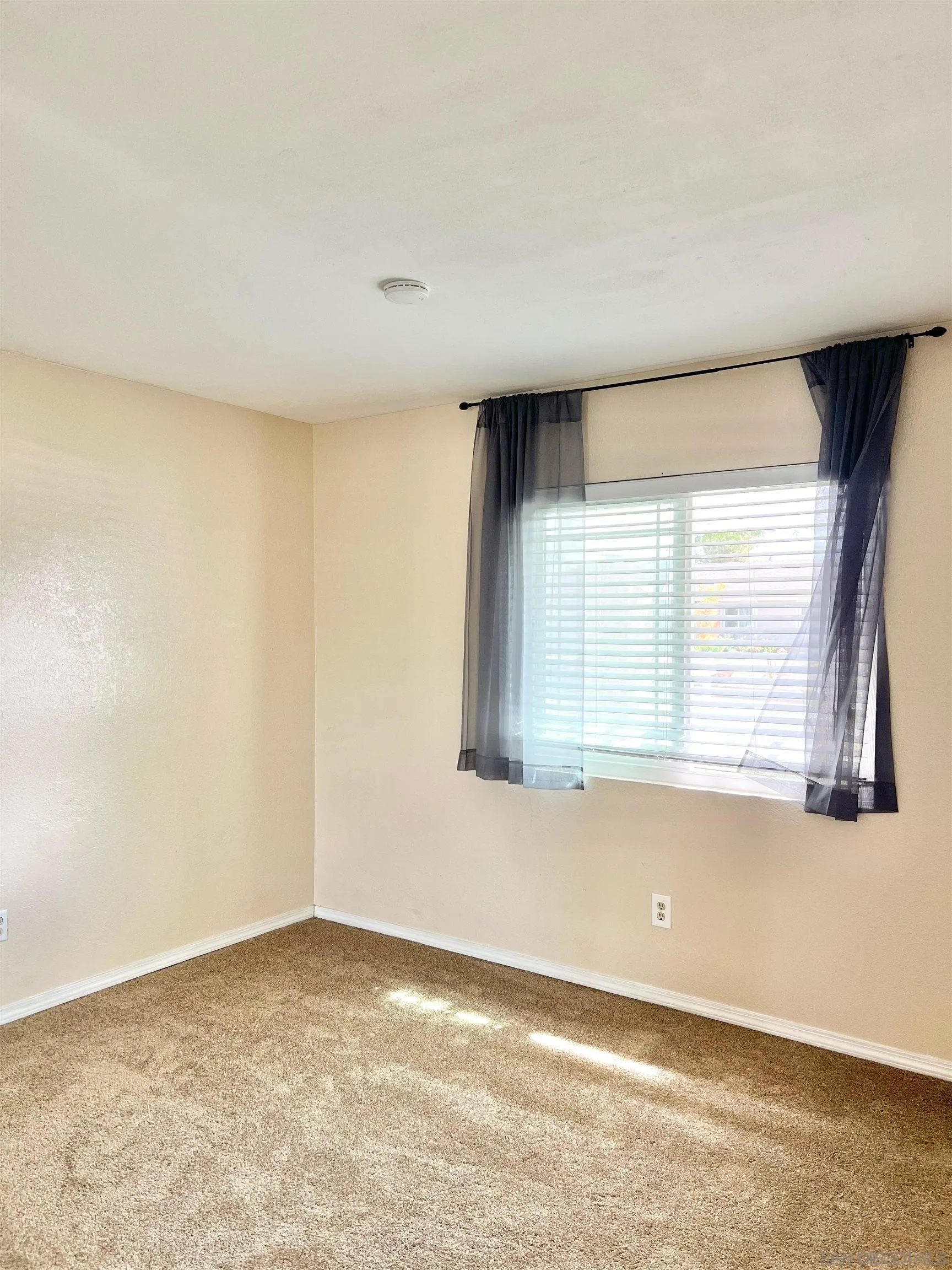 9212 Lake Hill Road Santee, CA 92071 - Photo 26 of 42 an empty room with a window
