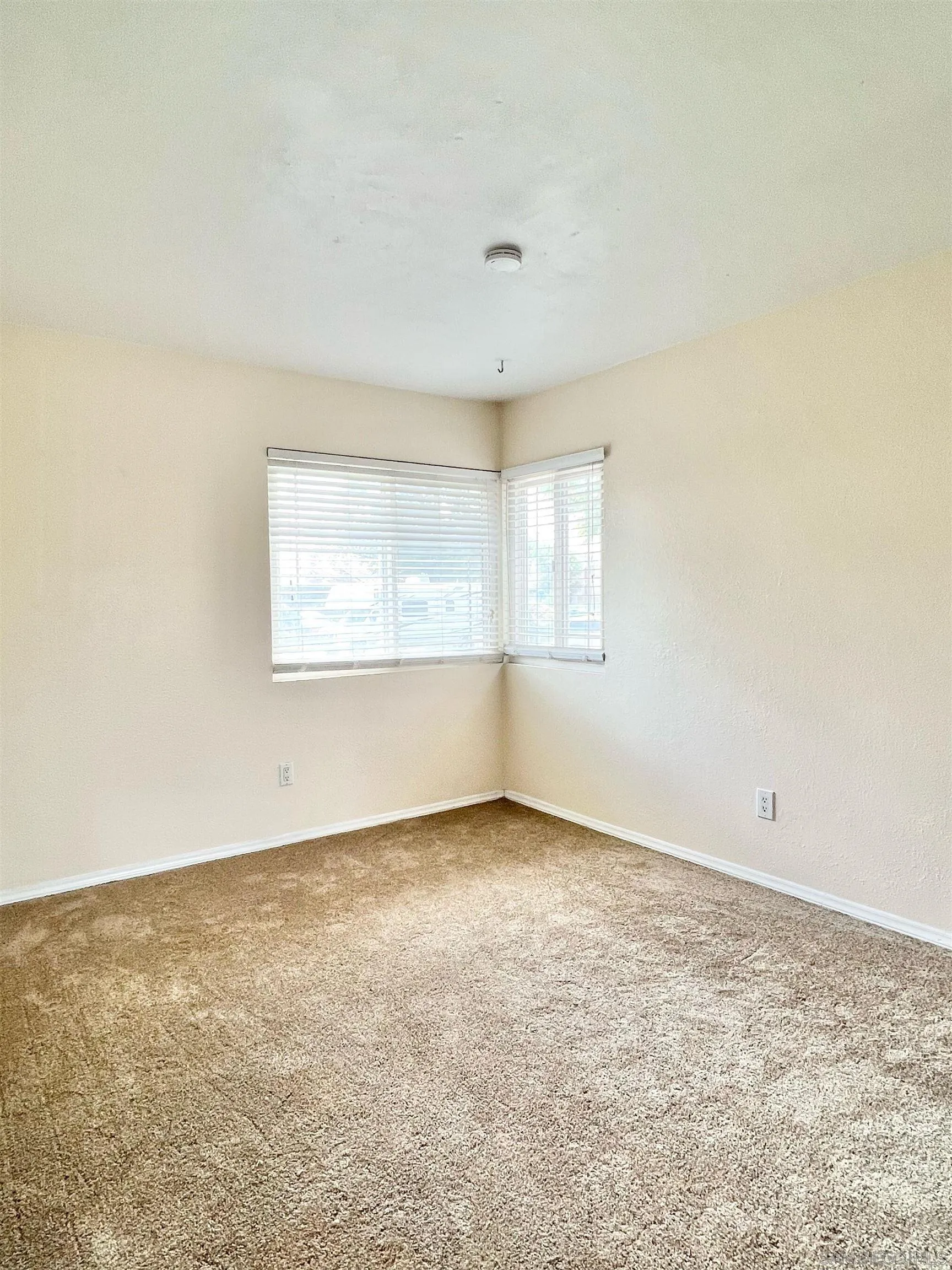 9212 Lake Hill Road Santee, CA 92071 - Photo 27 of 42 an empty room with a window