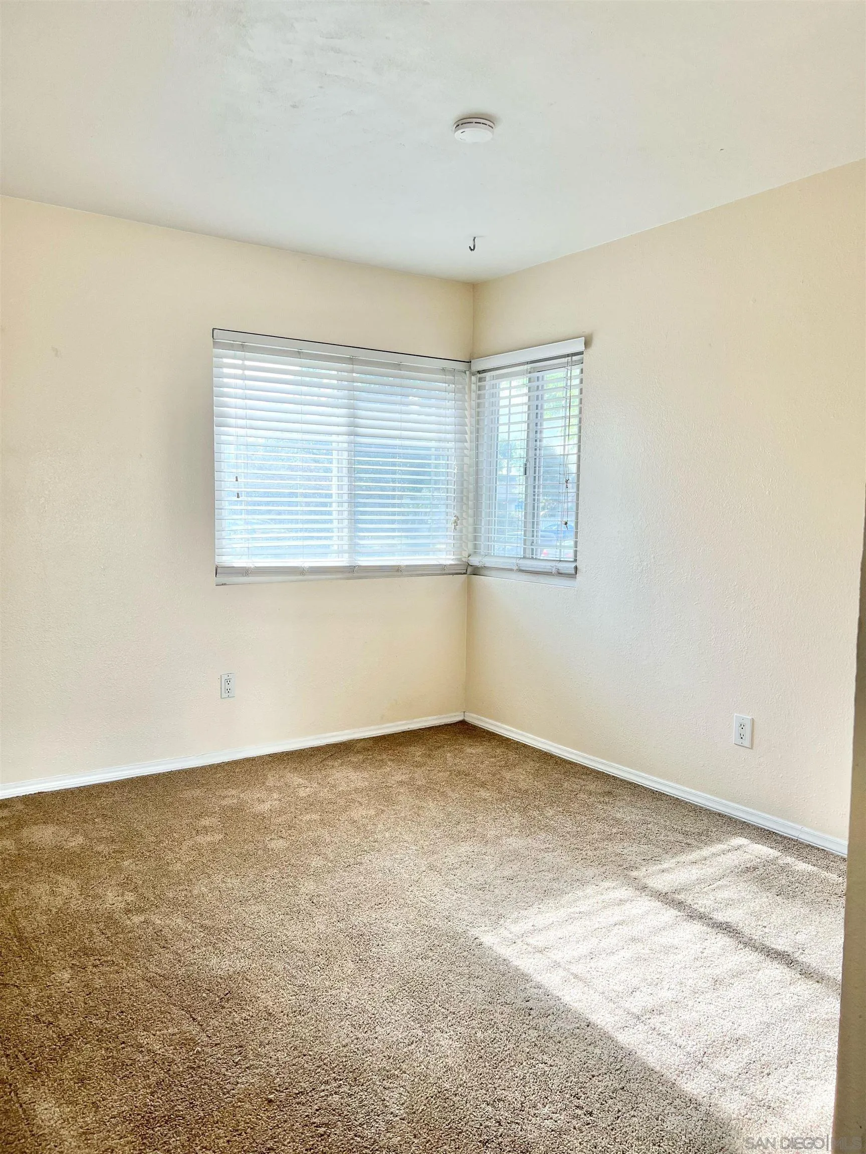 9212 Lake Hill Road Santee, CA 92071 - Photo 28 of 42 an empty room with a empty space and windows