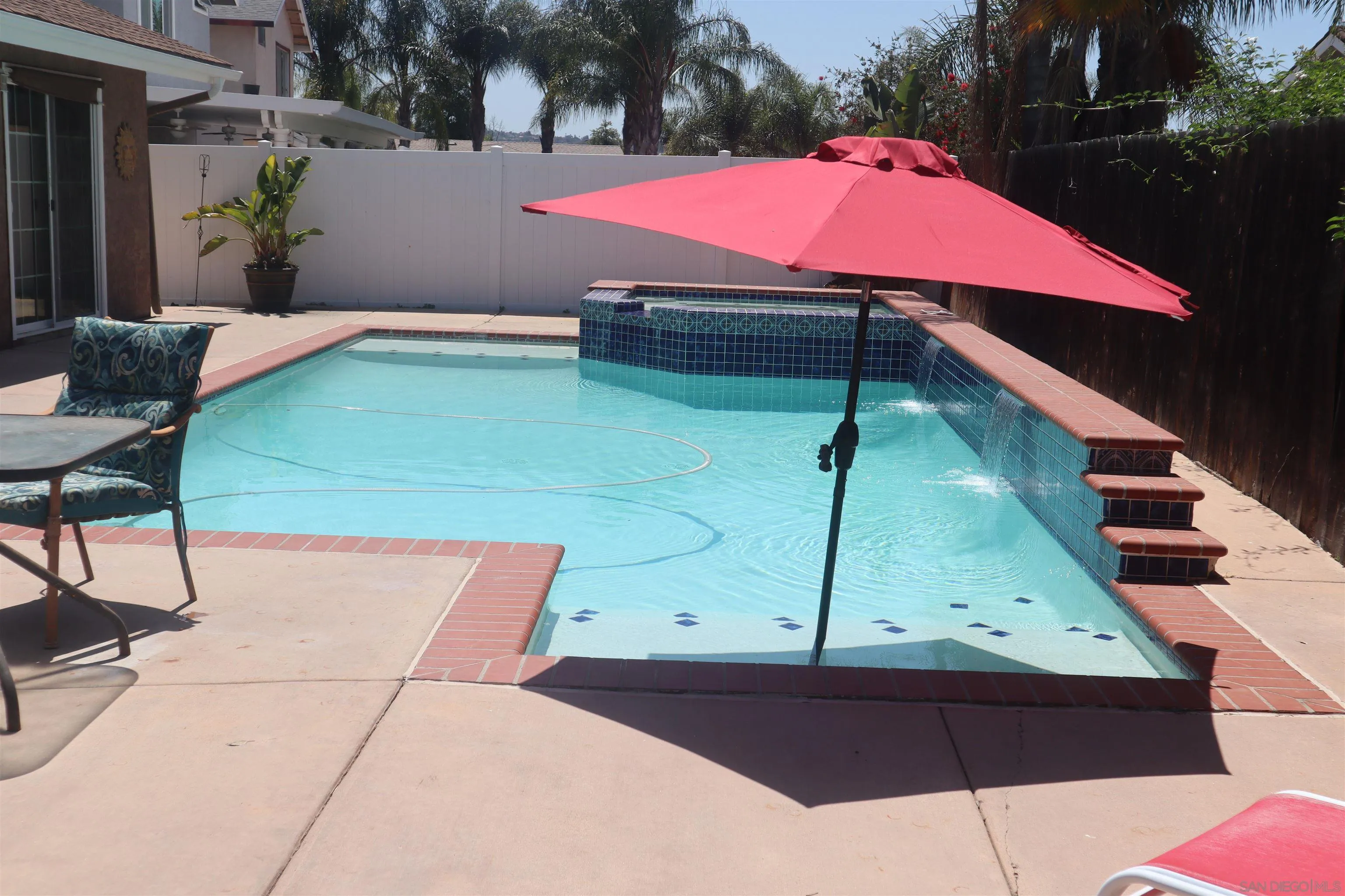 9212 Lake Hill Road Santee, CA 92071 - Photo 30 of 42 a patio with table and chairs