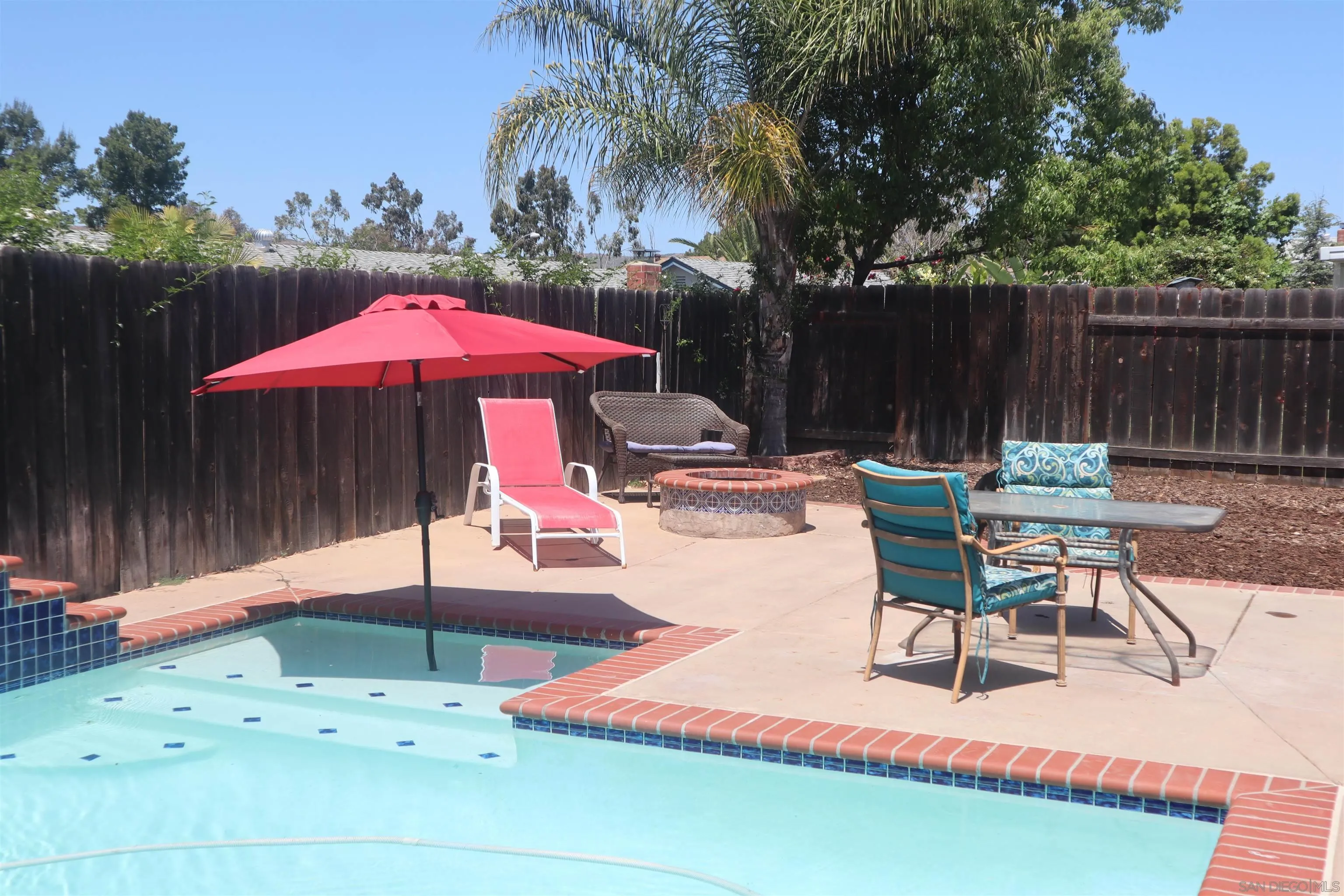 9212 Lake Hill Road Santee, CA 92071 - Photo 31 of 42 a view of backyard with seating space and wooden fence