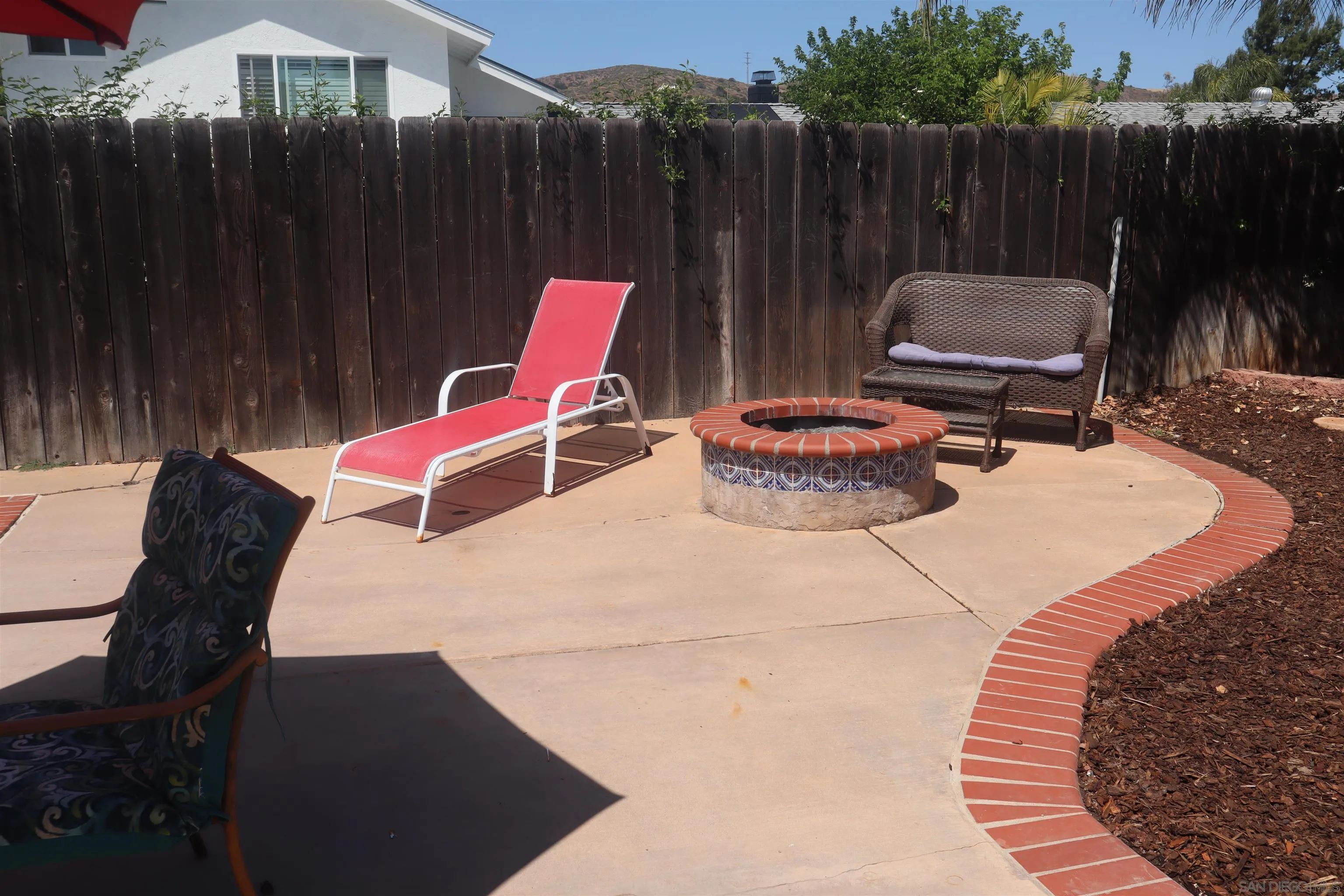 9212 Lake Hill Road Santee, CA 92071 - Photo 38 of 42 an outdoor sitting area with furniture and wooden floor