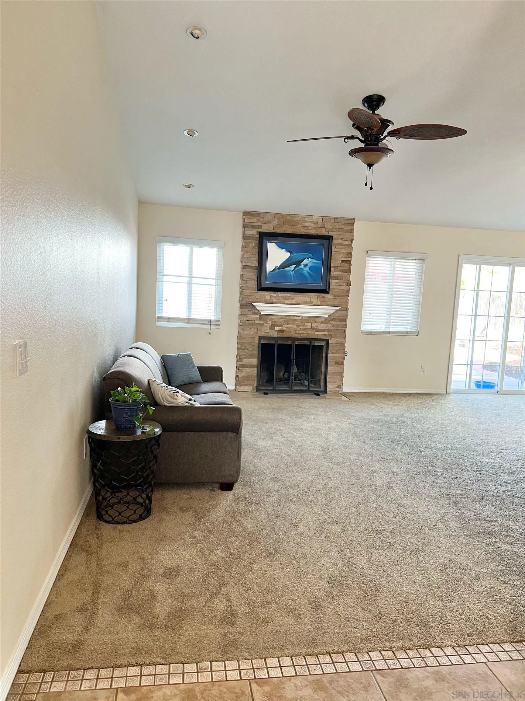 9212 Lake Hill Road Santee, CA 92071 - Photo 7 of 42 a living room with furniture and a fireplace