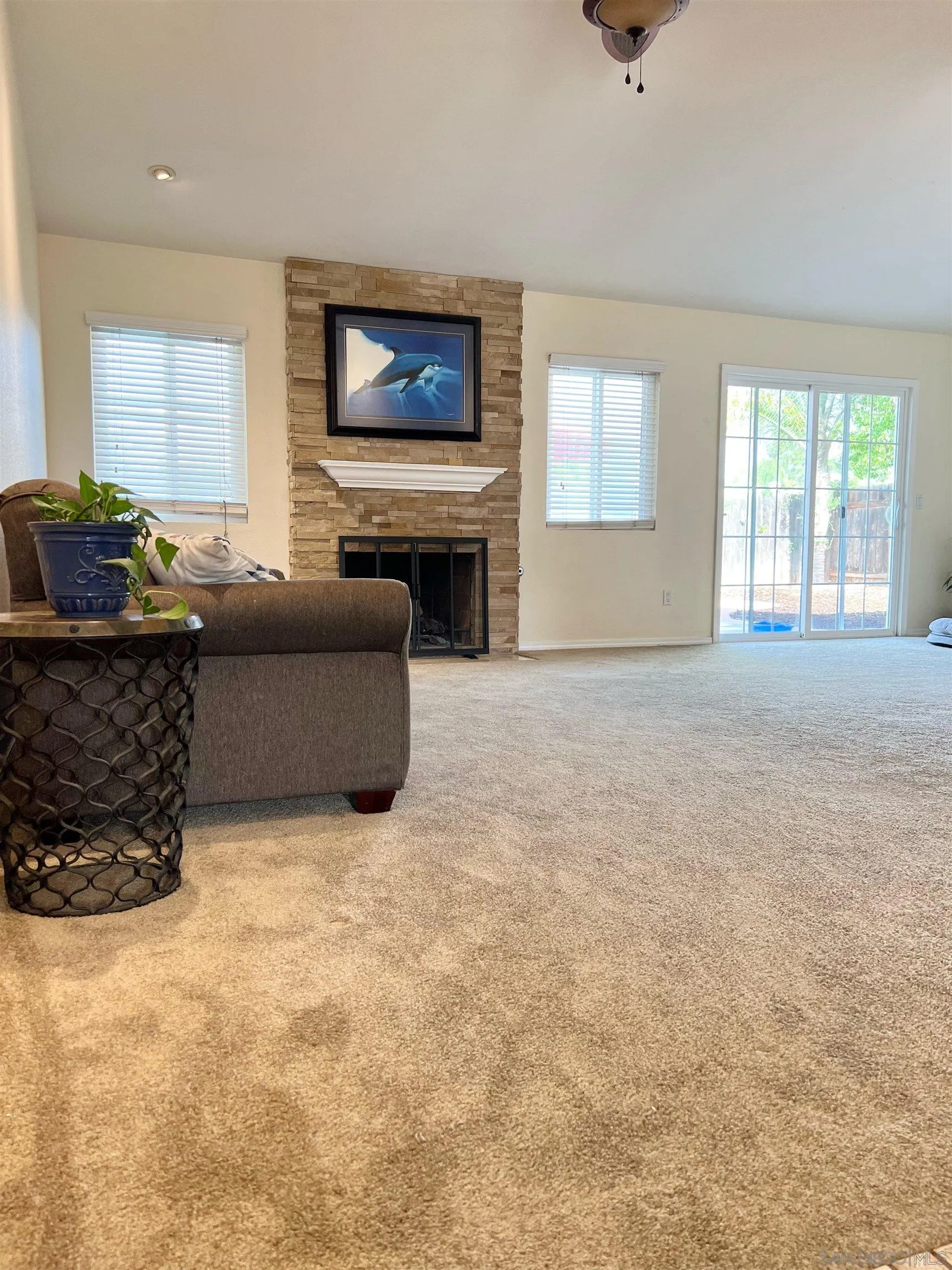 9212 Lake Hill Road Santee, CA 92071 - Photo 8 of 42 a living room with furniture and a flat screen tv