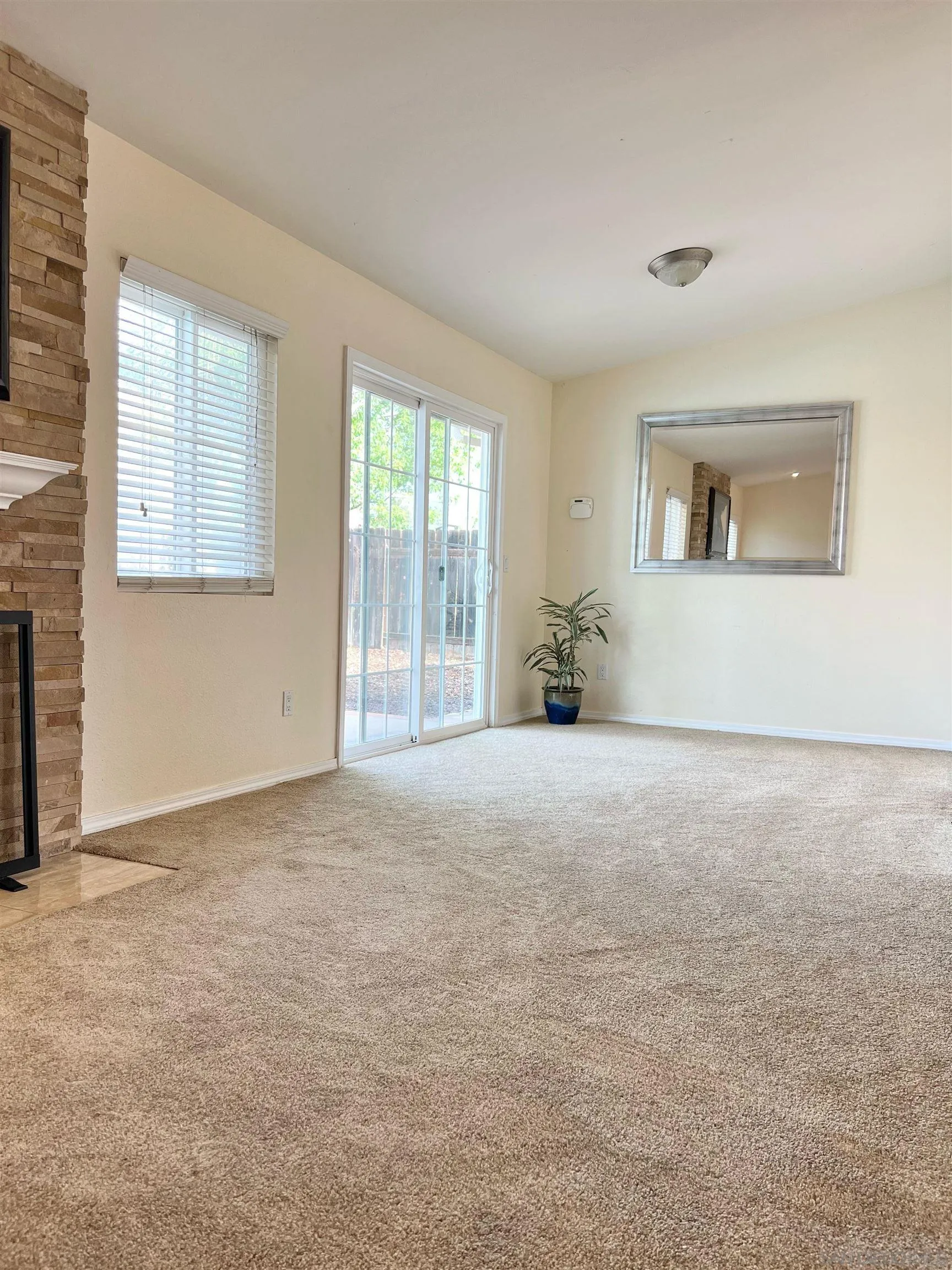 9212 Lake Hill Road Santee, CA 92071 - Photo 10 of 42 a view of an empty room with a window