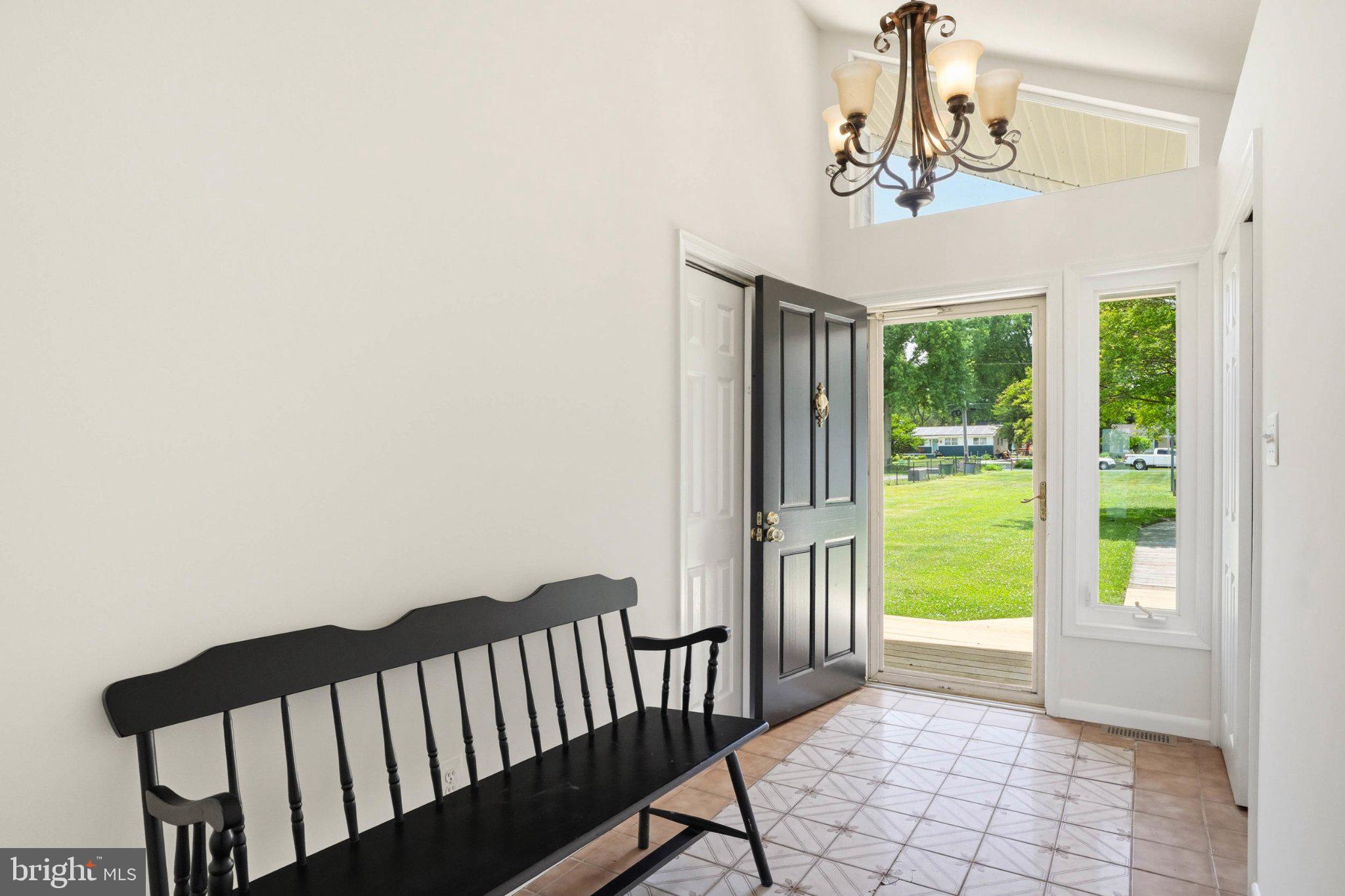 1100 River Bay Road Annapolis, MD 21409 - Photo 11 of 67 a view of a balcony with furniture and floor to ceiling window