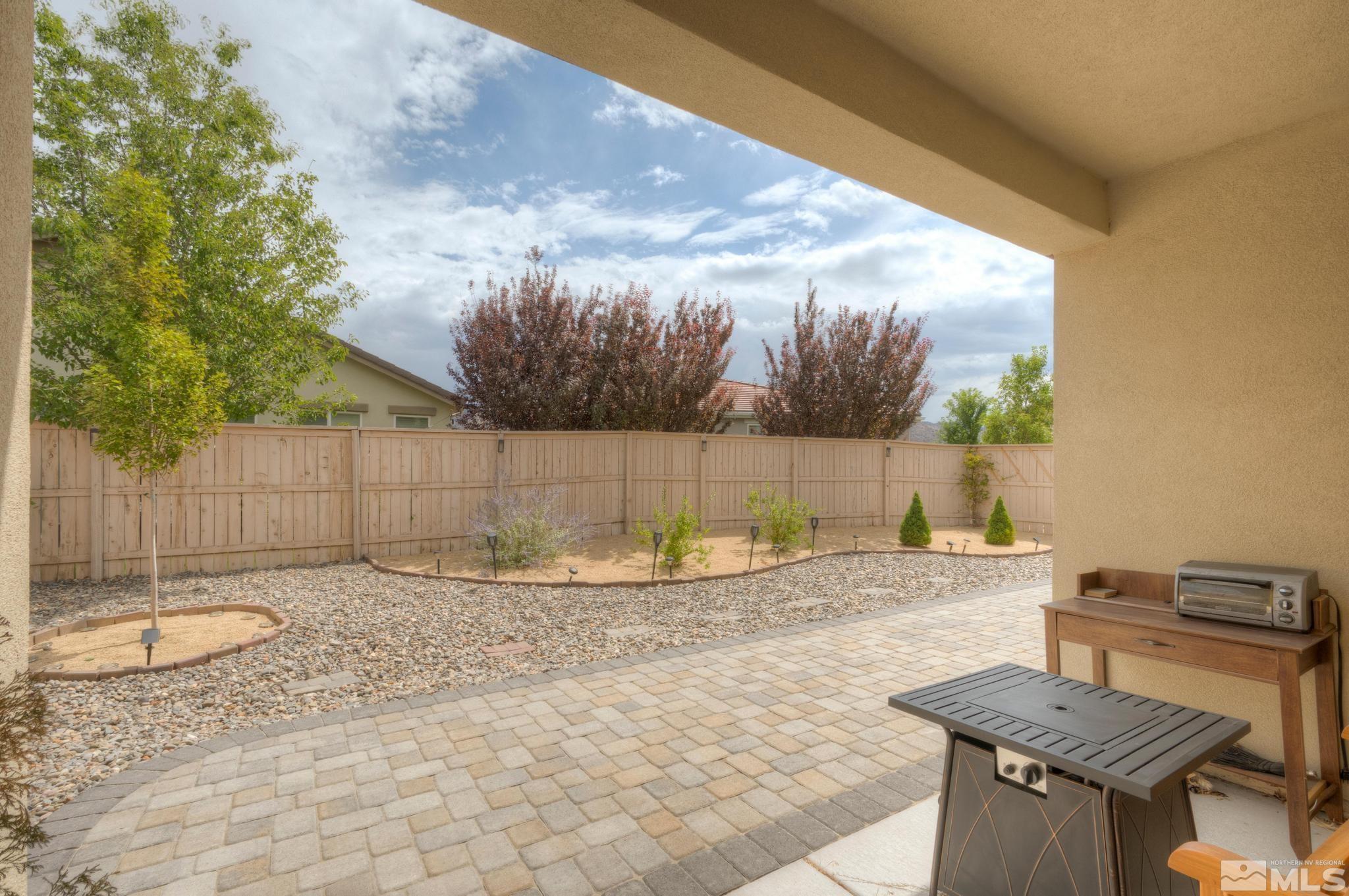 10180 Culiacan Pass Trail Reno, NV 89521 - Photo 34 of 34 a backyard of a house with table and chairs
