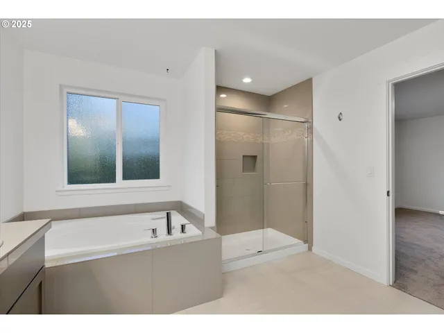 a bathroom with a bathtub and a sink