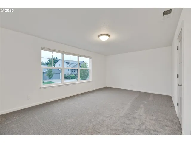 a view of a room that has a window in it