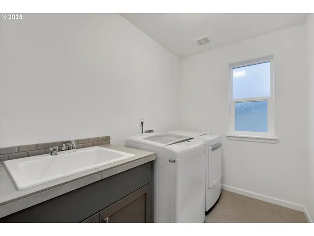 a utility room with dryer and washer