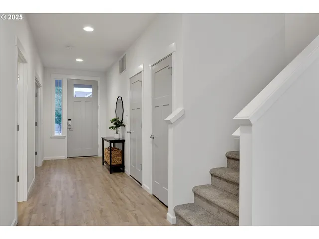 a view of a hallway view with staircase