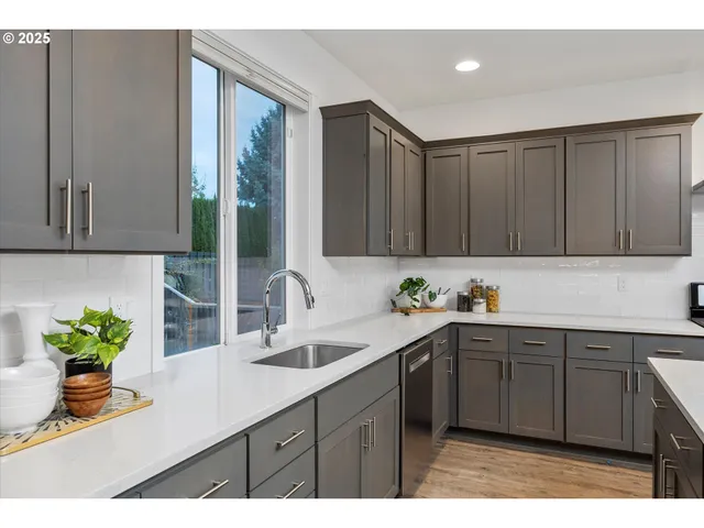 a kitchen with a sink and cabinets