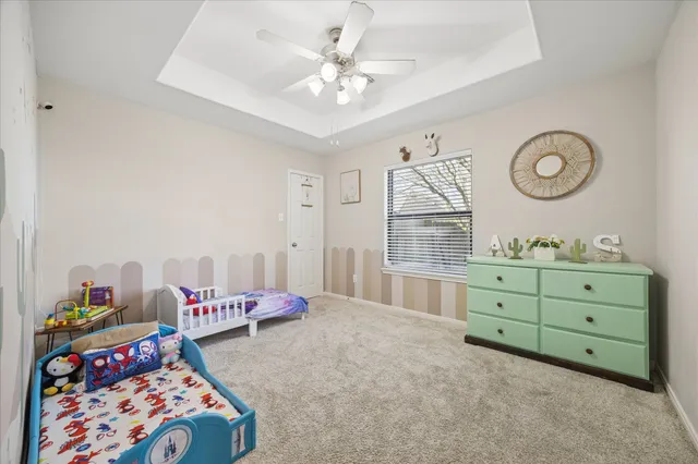 a bed room with a bed and a dresser