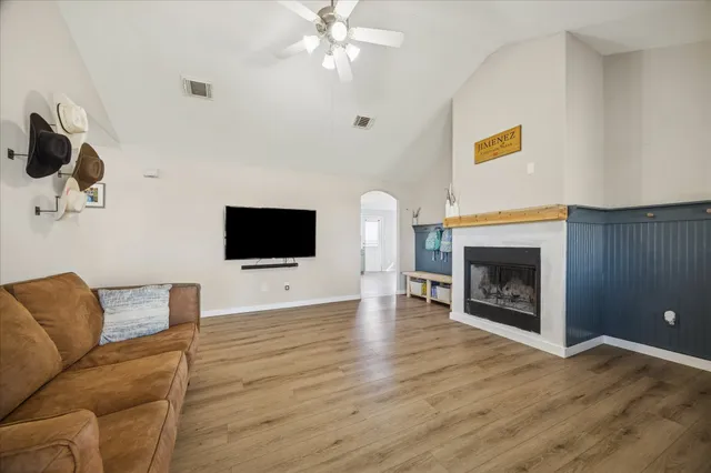a living room with furniture and a flat screen tv