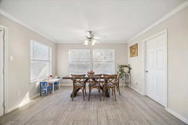 a view of a dining room with furniture and wooden floor