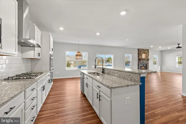 a view of an empty room with wooden and a window