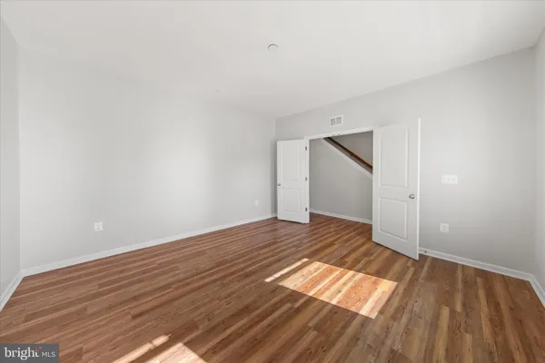 a bathroom with a shower and a sink