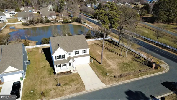 an aerial view of a house with a ocean view