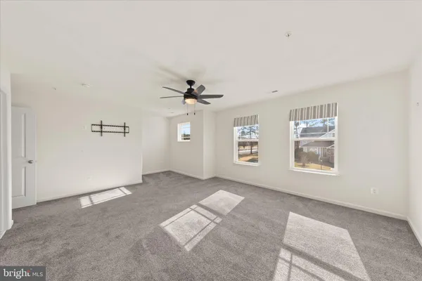 a bedroom with bed and window