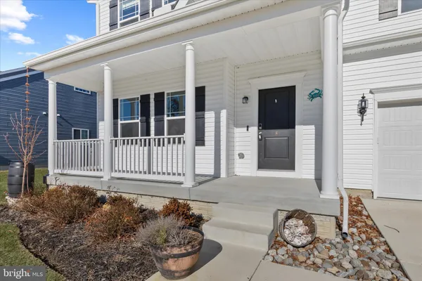 a living room with fireplace furniture and a wooden floor