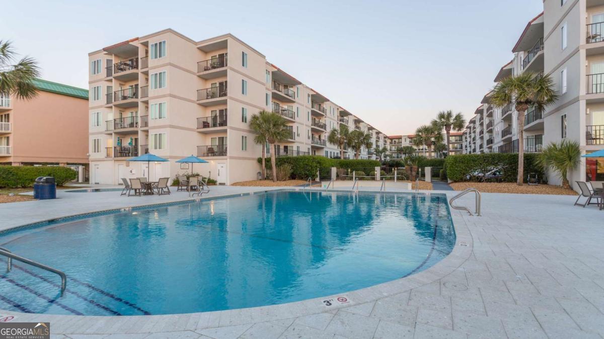 1440 Ocean Boulevard, Unit 224 St. Simons, GA 31522 - Photo 19 of 26 a view of a swimming pool with a lake view