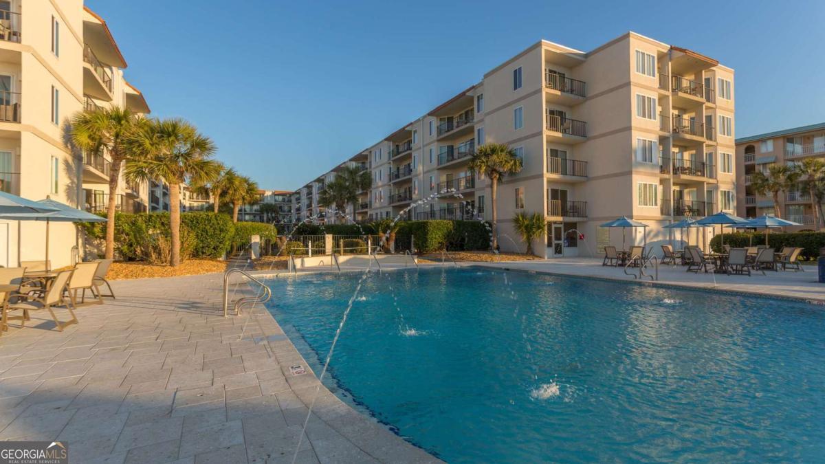 1440 Ocean Boulevard, Unit 224 St. Simons, GA 31522 - Photo 21 of 26 a view of building with swimming pool