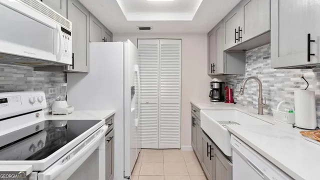 a living room with furniture or couch and a potted plant