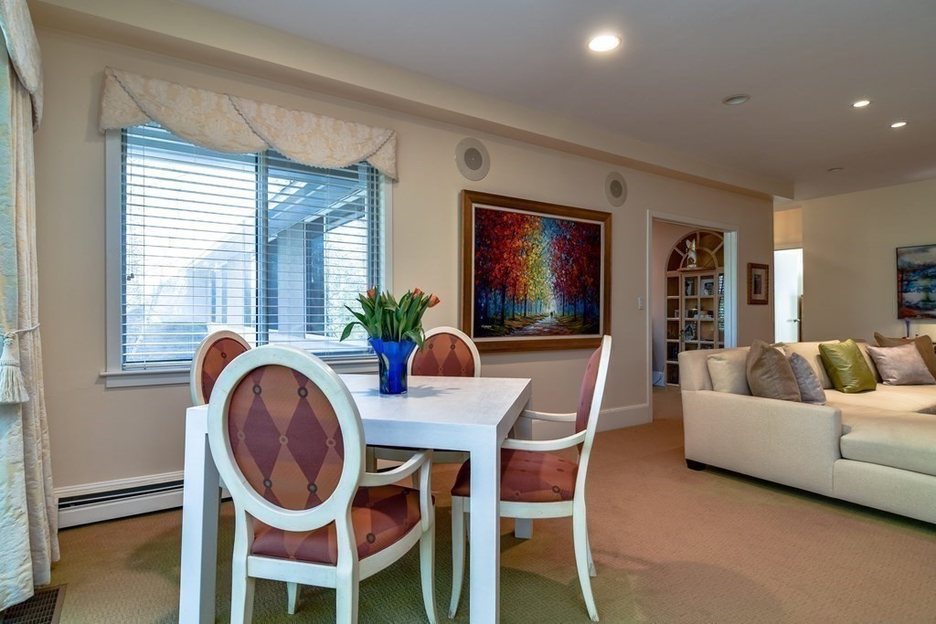 206 Allandale Road, Unit 2D Boston, MA 02467 - Photo 13 of 39 a dining room with furniture and window
