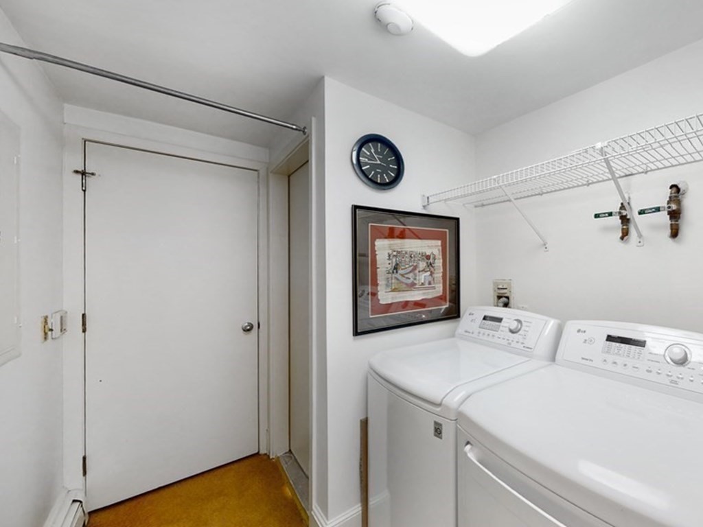 206 Allandale Road, Unit 2D Boston, MA 02467 - Photo 19 of 39 a bathroom with a sink and a mirror