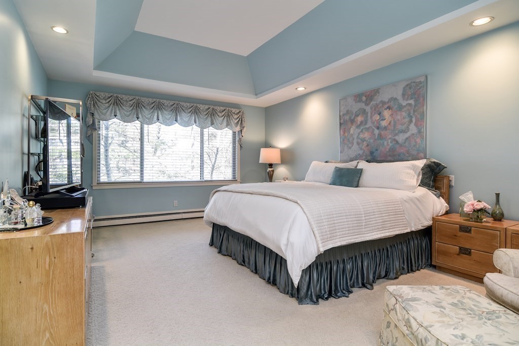 206 Allandale Road, Unit 2D Boston, MA 02467 - Photo 29 of 39 a bedroom with a bed couch and a window