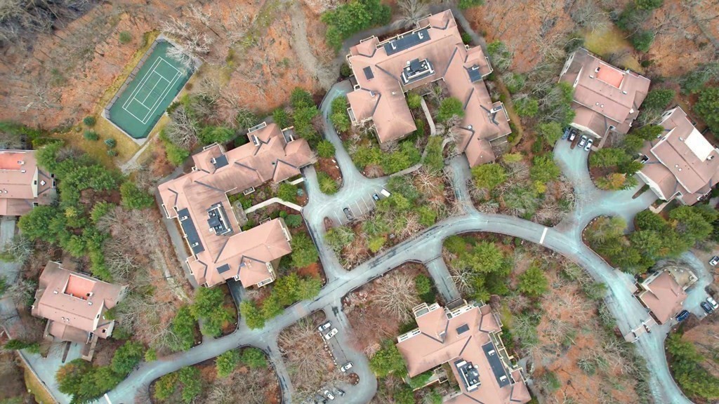 206 Allandale Road, Unit 2D Boston, MA 02467 - Photo 34 of 39 an aerial view of a house with a yard and flowers