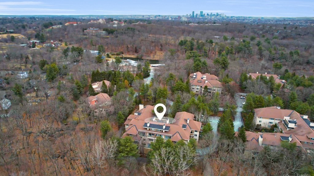 206 Allandale Road, Unit 2D Boston, MA 02467 - Photo 5 of 39 an aerial view of a house with a lake view