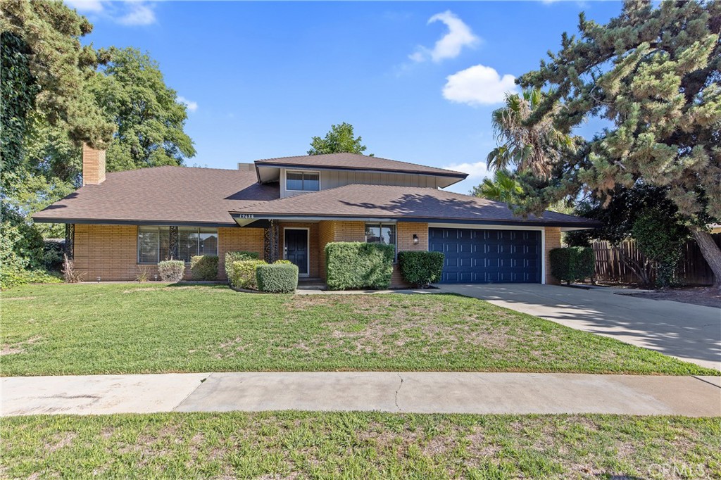 19638 Perry Avenue Rialto, CA 92377 - Photo 1 of 1 a front view of a house with a yard