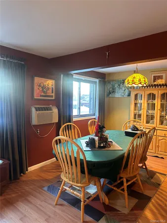 a view of a dining room with furniture and window