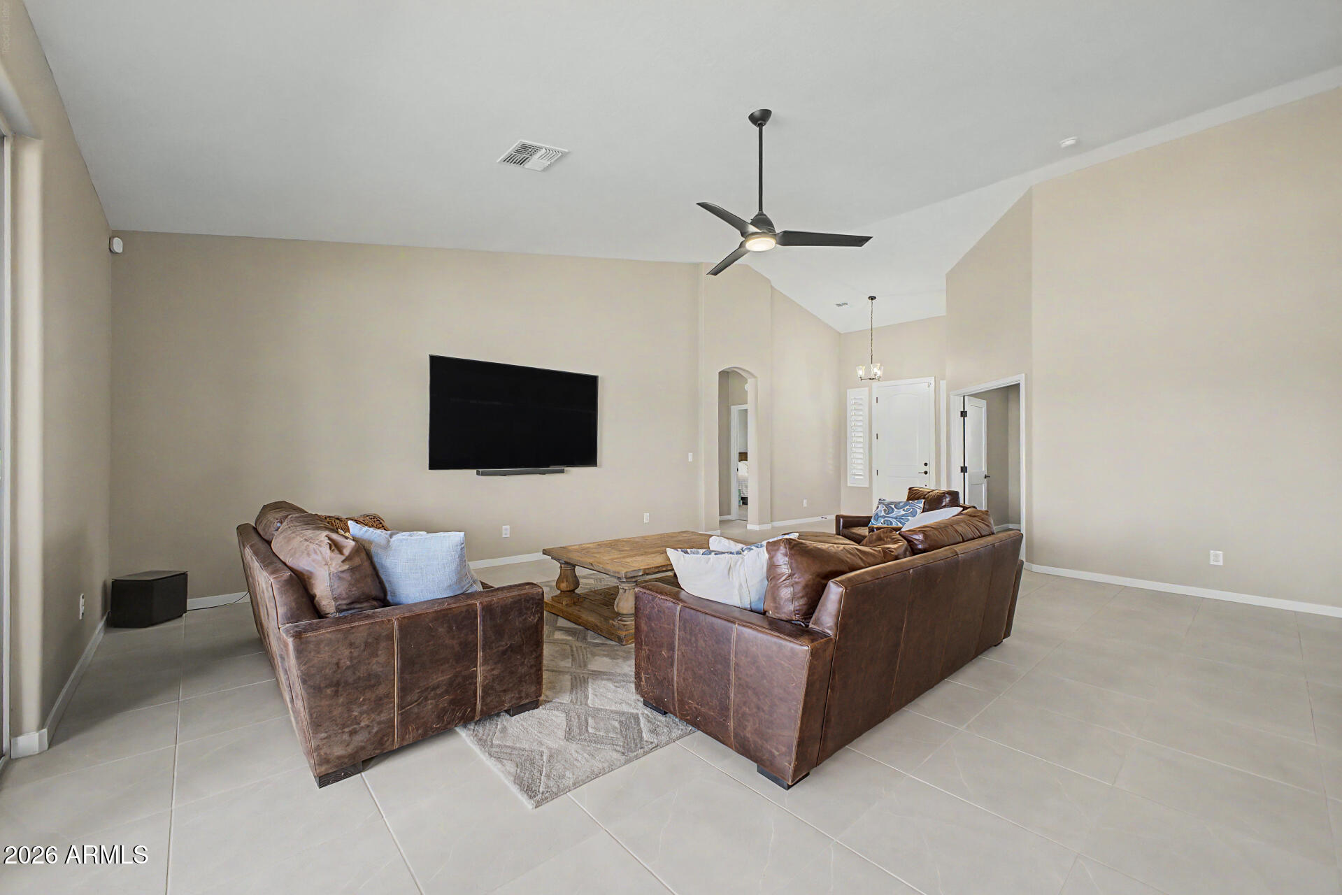 17416 East Windstone Trail Rio Verde, AZ 85263 - Photo 13 of 41 a living room with furniture and a flat screen tv