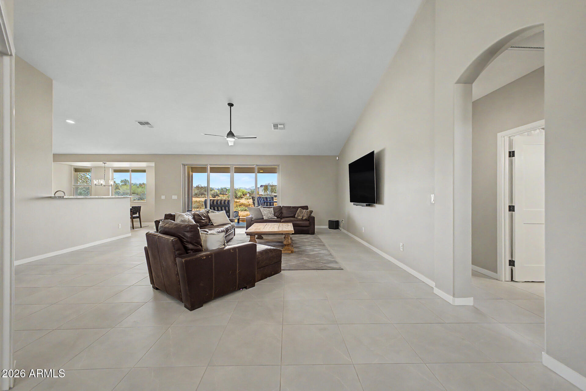 17416 East Windstone Trail Rio Verde, AZ 85263 - Photo 8 of 41 a living room with furniture and a flat screen tv