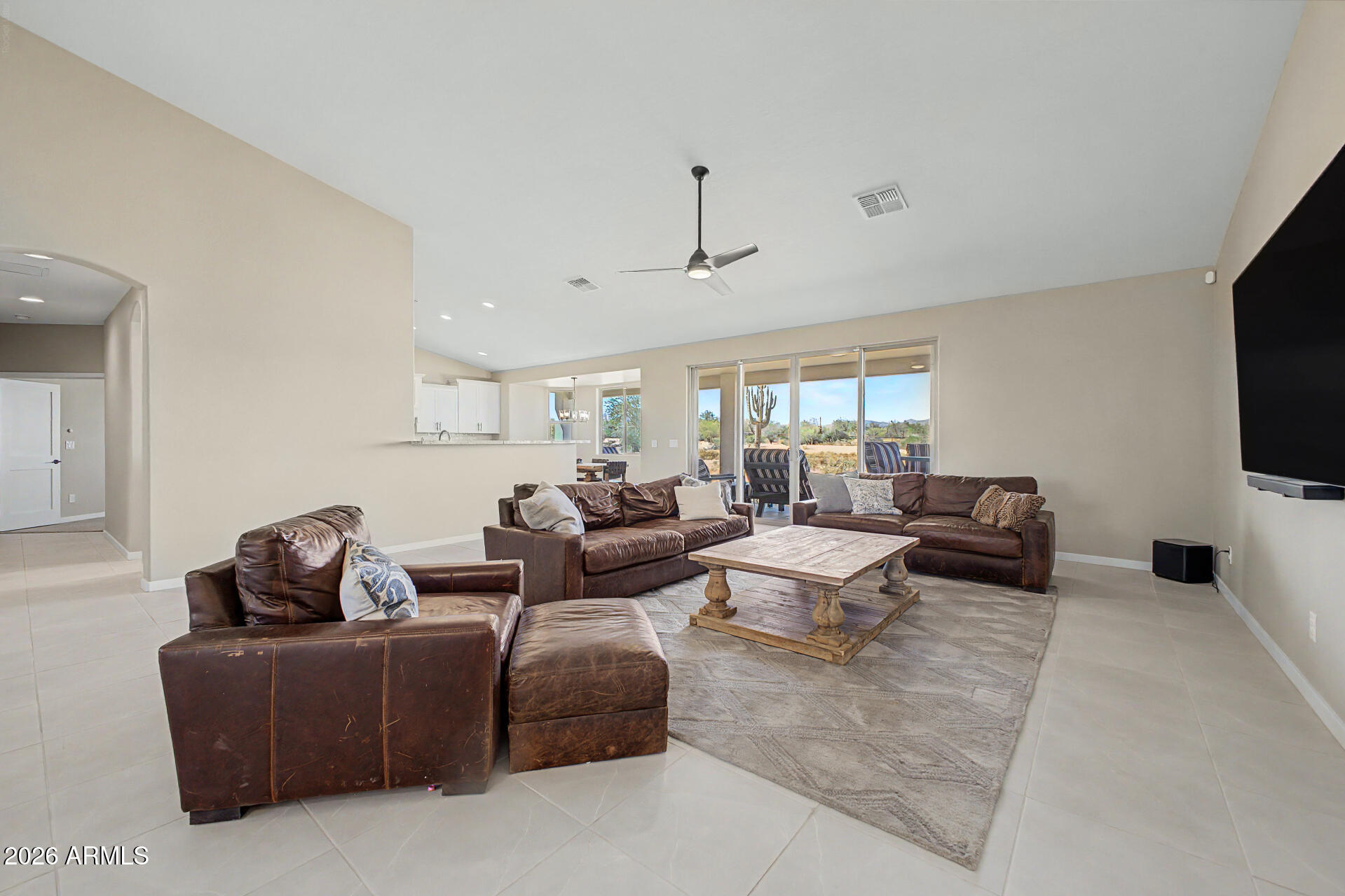 17416 East Windstone Trail Rio Verde, AZ 85263 - Photo 9 of 41 a living room with furniture and a flat screen tv