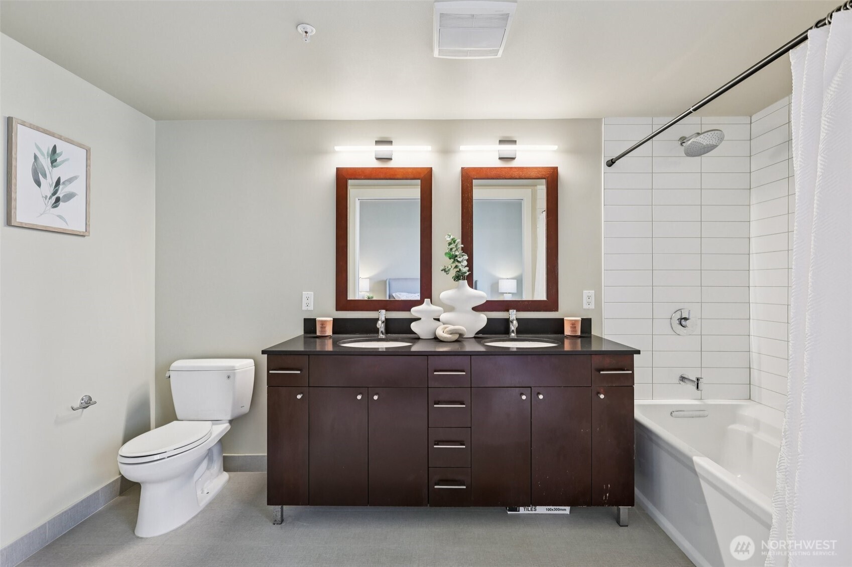 76 Cedar Street, Unit S1005 Seattle, WA 98121 - Photo 12 of 30 a spacious bathroom with a granite countertop sink a toilet and a bathtub