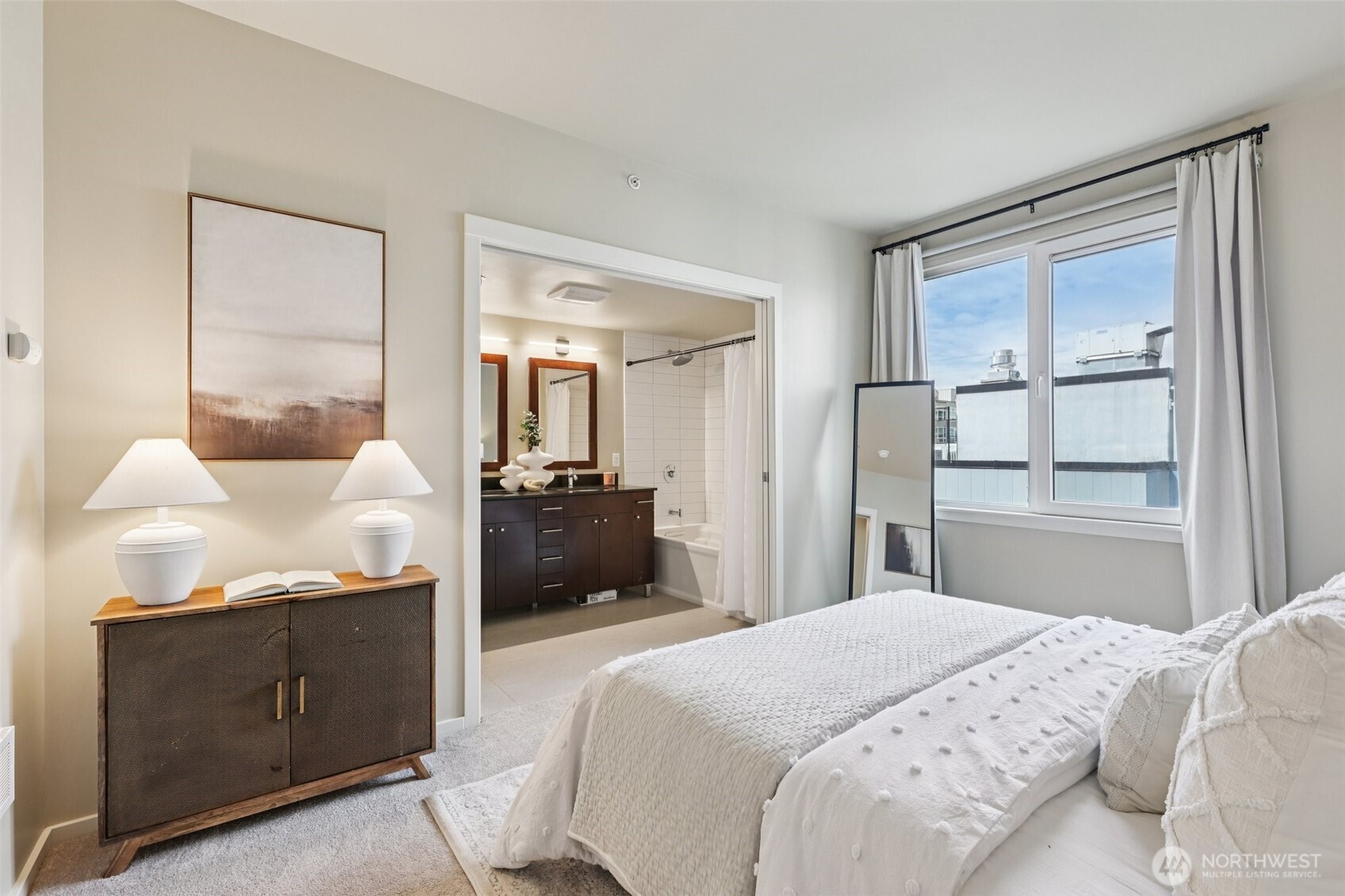 76 Cedar Street, Unit S1005 Seattle, WA 98121 - Photo 13 of 30 a bedroom with a bed and wooden floor